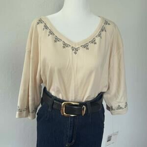 Vintage buttercream v-neck tee with black embroidery